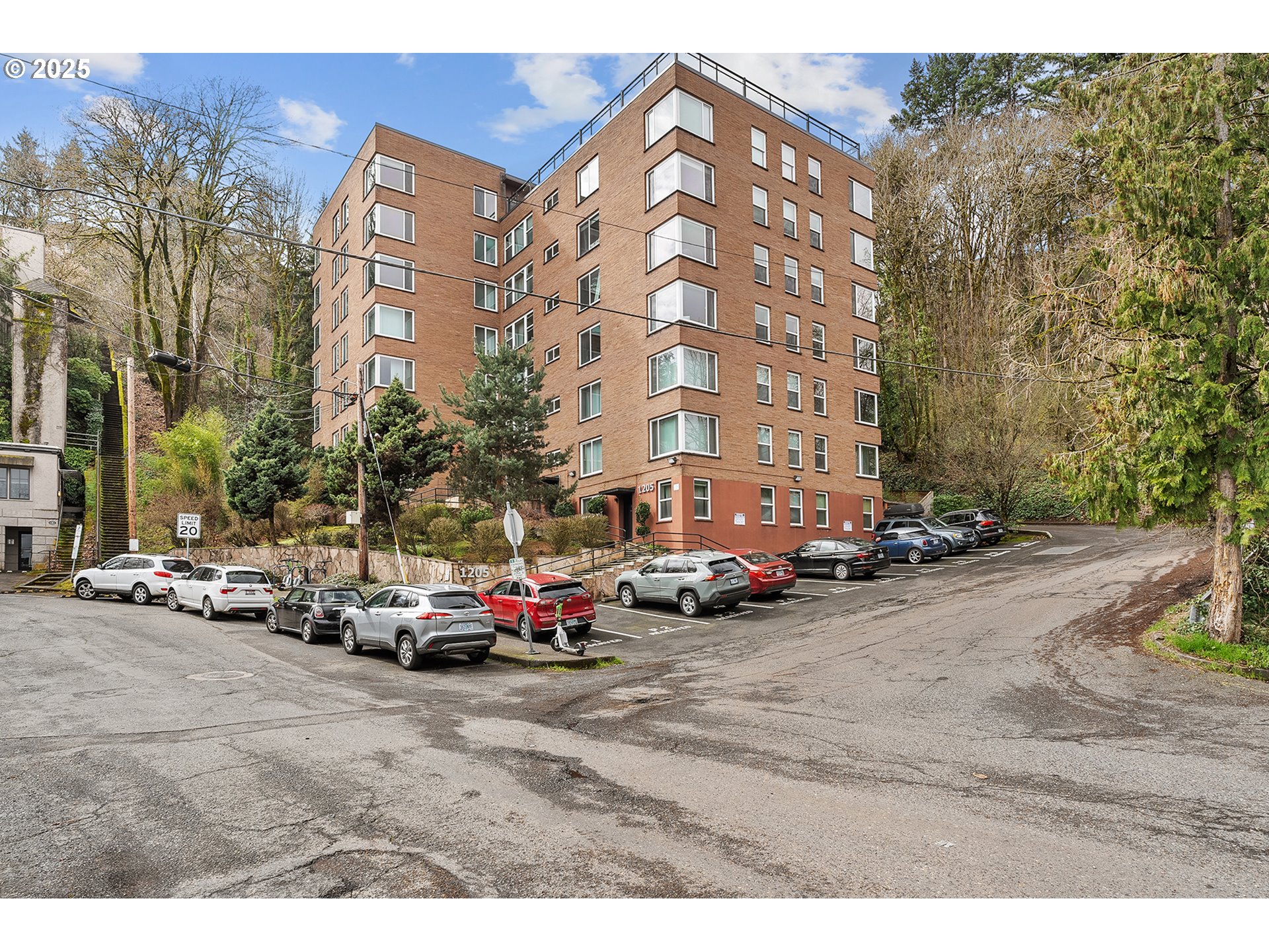 1205 Southwest Cardinell Drive, Unit 704 Portland, OR 97201 - Photo 1 of 23 a view of a cars parked in front of a building