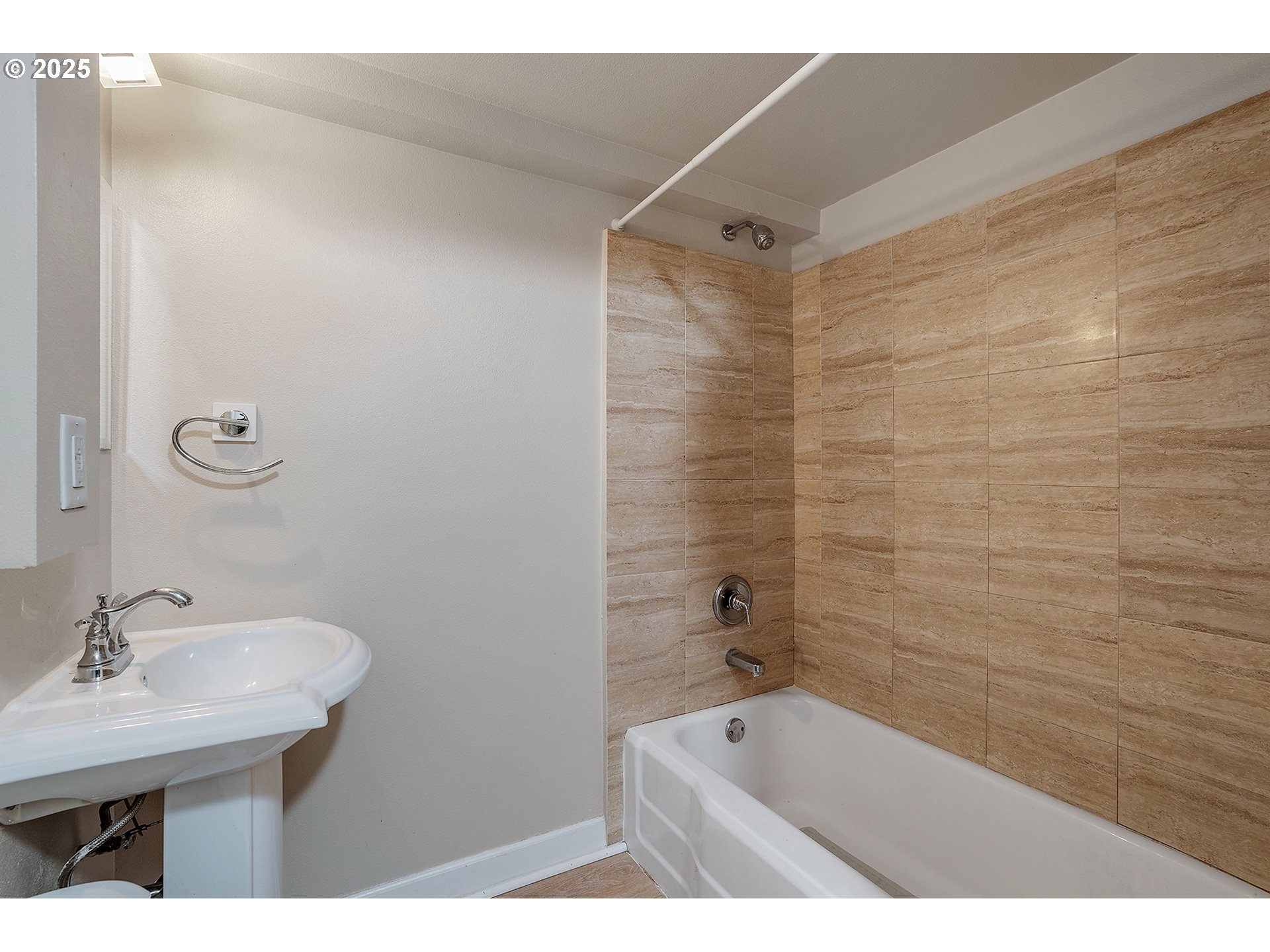 1205 Southwest Cardinell Drive, Unit 704 Portland, OR 97201 - Photo 15 of 23 a bathroom with a sink and a bathtub