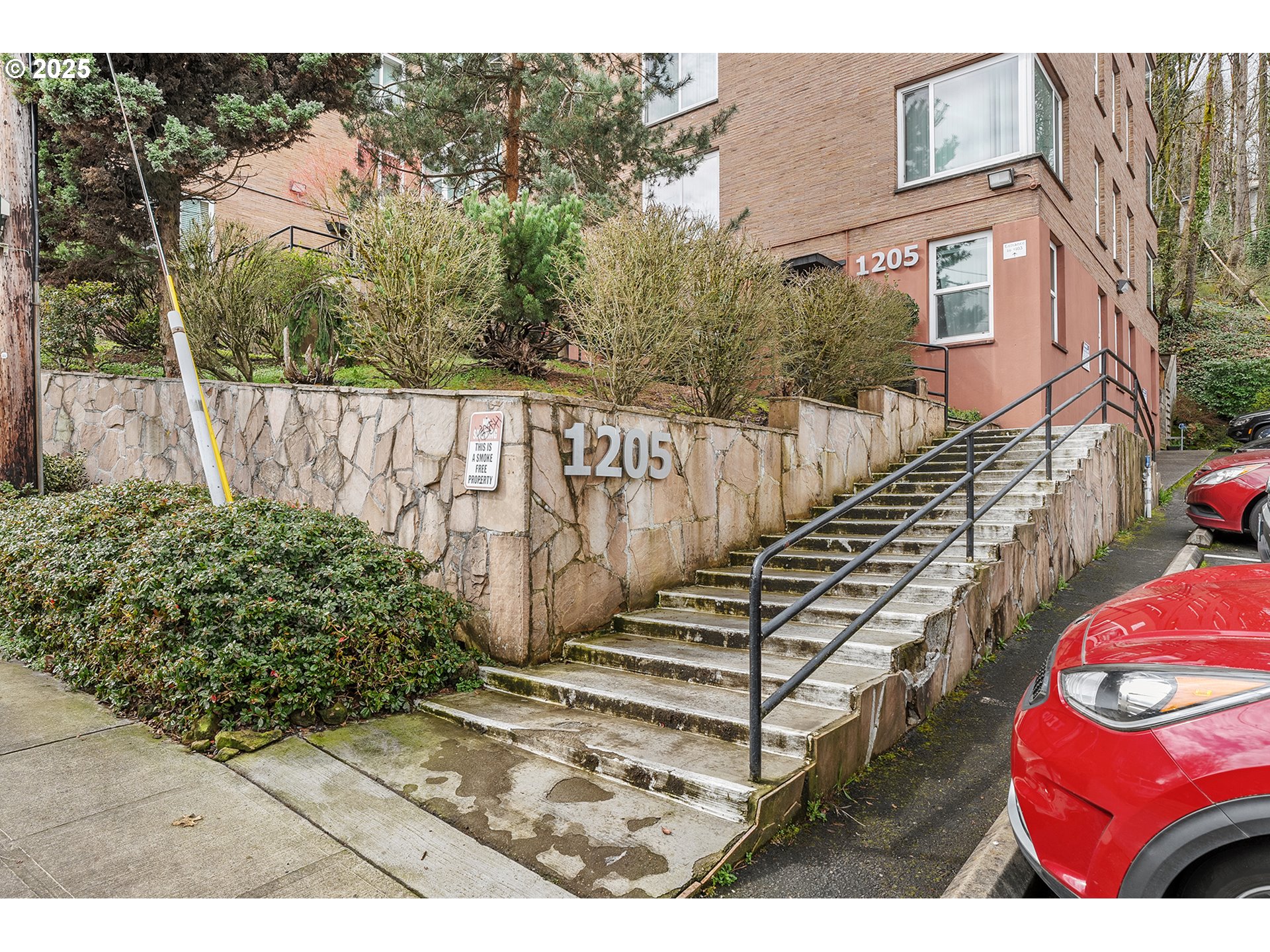 1205 Southwest Cardinell Drive, Unit 704 Portland, OR 97201 - Photo 2 of 23 a view of stairs and yard