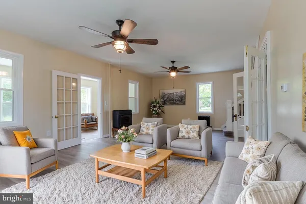 a living room with furniture and a large window
