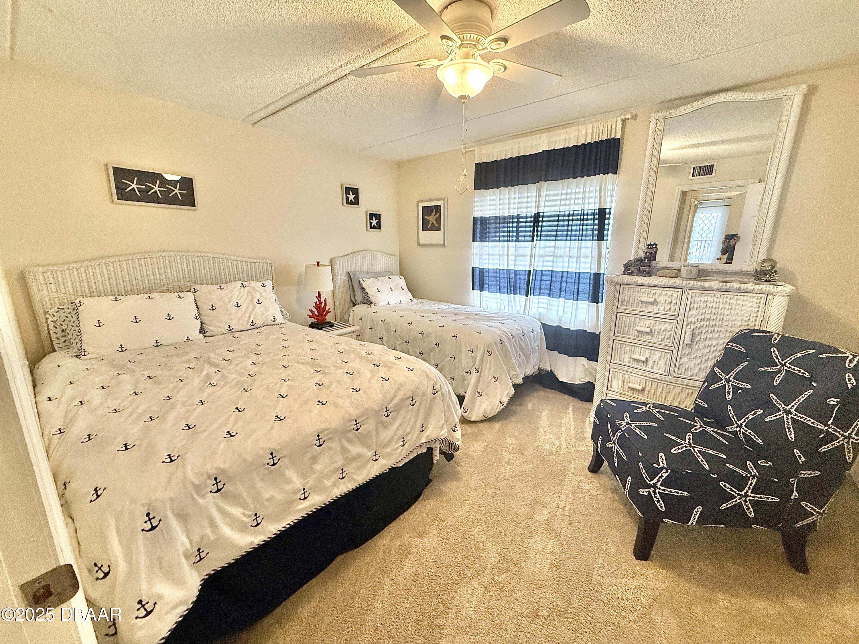 30 Inlet Harbor Road, Unit 606 Ponce Inlet, FL 32127 - Photo 25 of 45 a bedroom with bed and window
