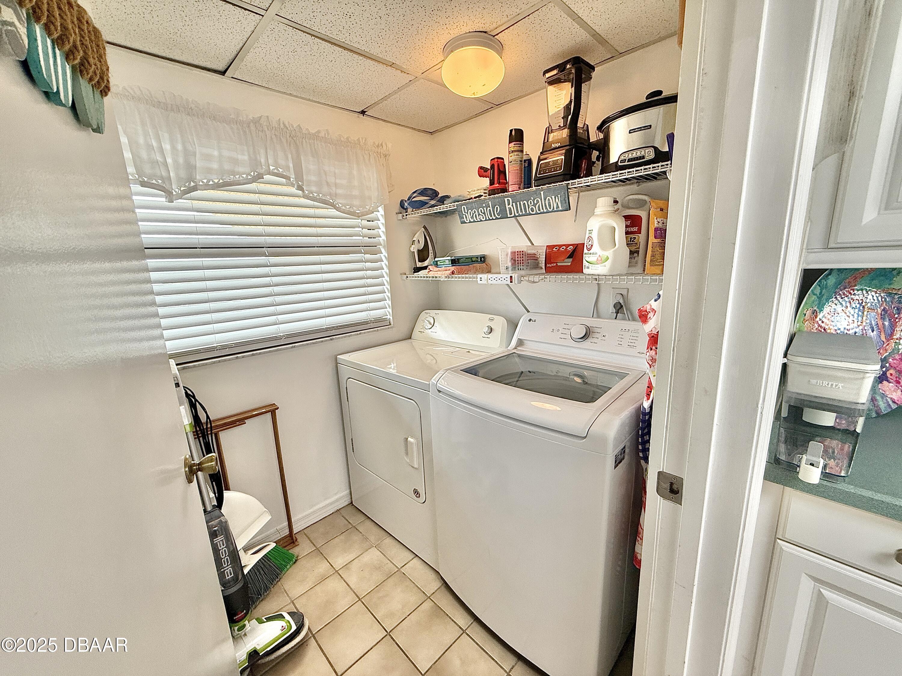 30 Inlet Harbor Road, Unit 606 Ponce Inlet, FL 32127 - Photo 31 of 45 a utility room with dryer and washer