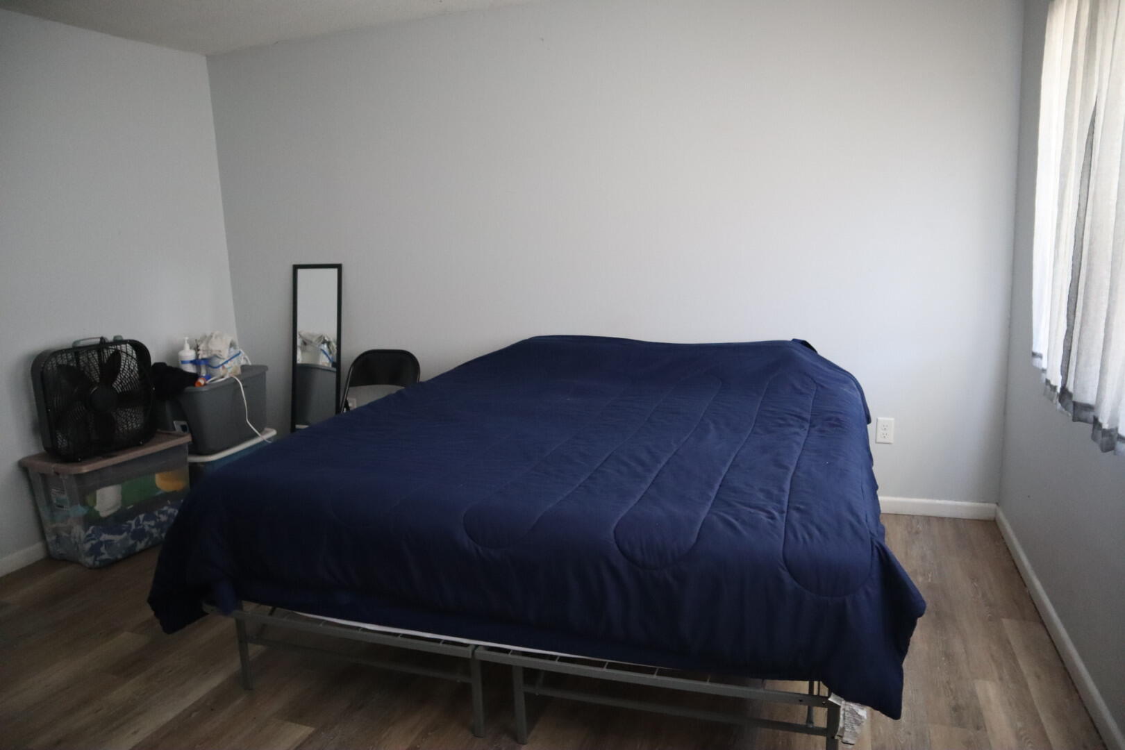 40 11th Street, Unit 99 Shalimar, FL 32579 - Photo 11 of 14 a bed sitting in a bedroom next to a window