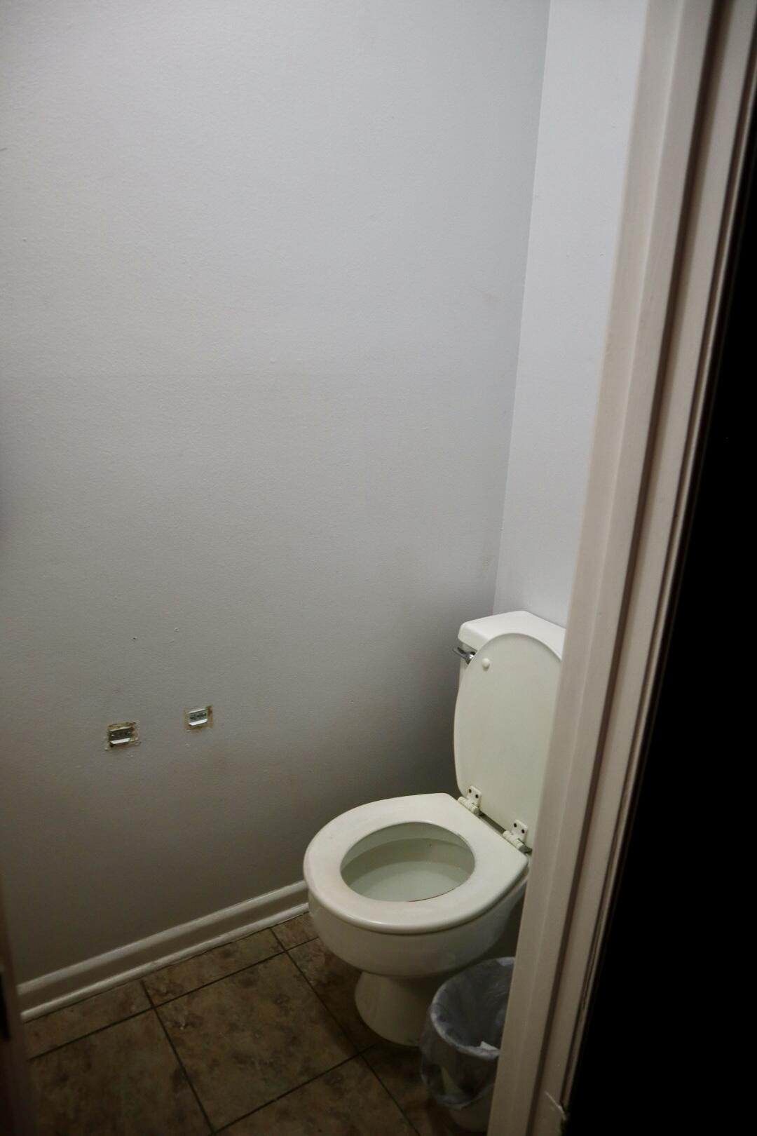 40 11th Street, Unit 99 Shalimar, FL 32579 - Photo 6 of 14 a white toilet sitting next to a sink
