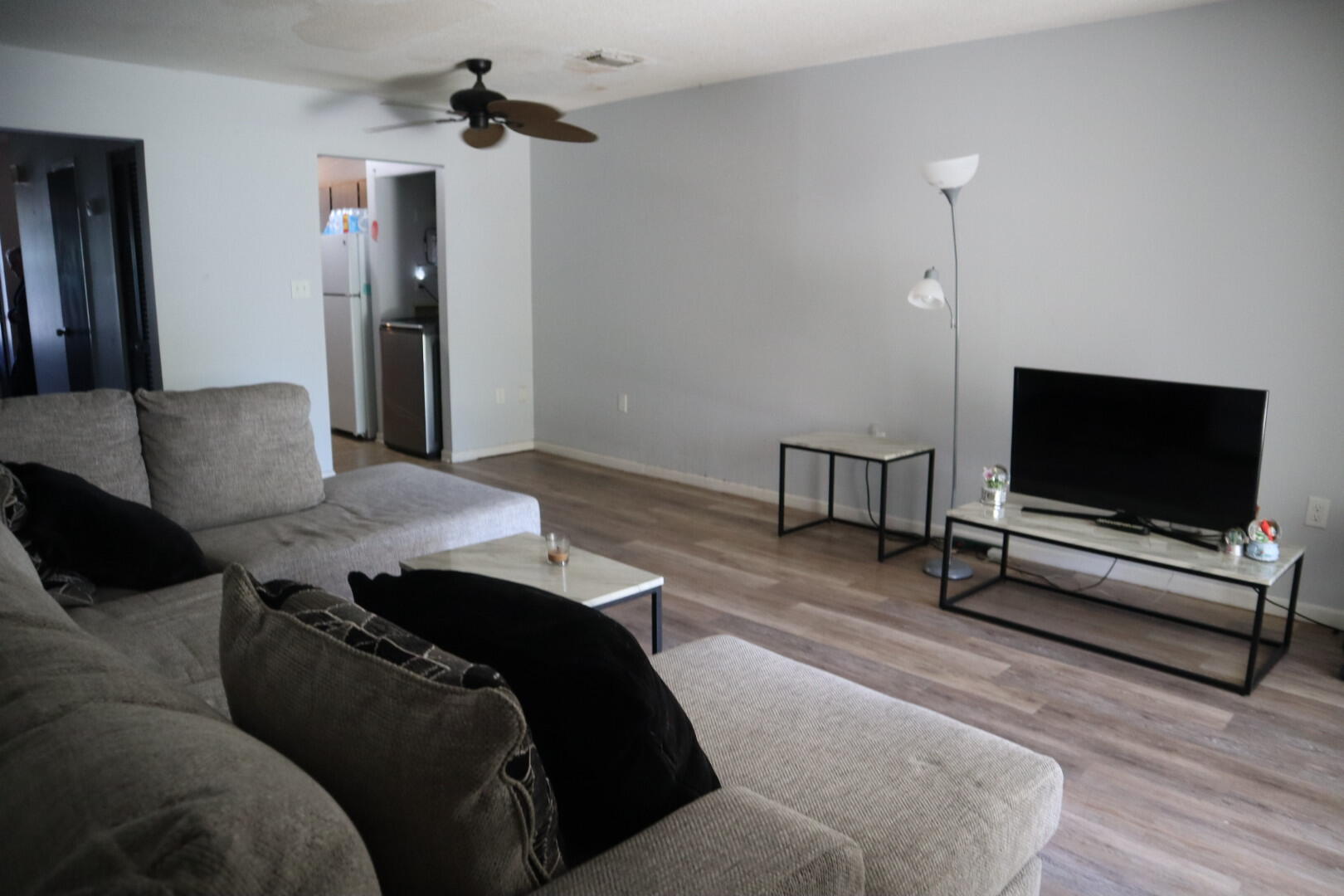 40 11th Street, Unit 99 Shalimar, FL 32579 - Photo 10 of 14 a living room with furniture and a flat screen tv