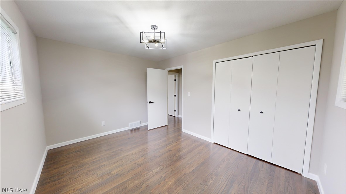 1224 Cordova Road Mayfield Heights, OH 44124 - Photo 16 of 29 Unfurnished bedroom featuring dark hardwood / wood-style floors and a closet