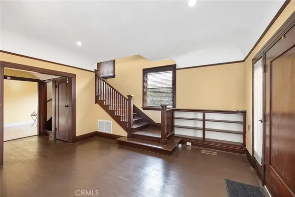 a kitchen with stainless steel appliances granite countertop a refrigerator a stove a sink a counter space and cabinets