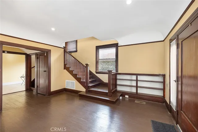 a kitchen with stainless steel appliances granite countertop a refrigerator a stove a sink a counter space and cabinets