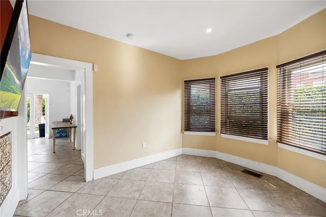 a bathroom with a toilet a sink a mirror and vanity