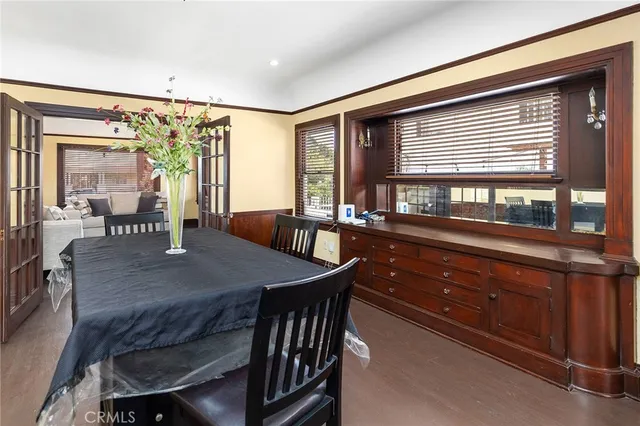 a view of a livingroom with a ceiling fan and wooden floor