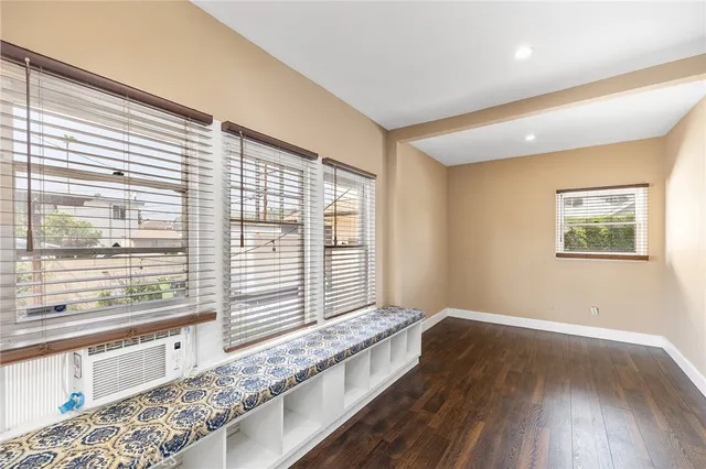 a bathroom with a granite countertop sink toilet a mirror and shower
