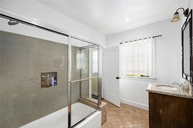a view of balcony with wooden floor and seating space