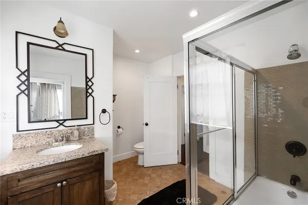 a view of a house with potted plants