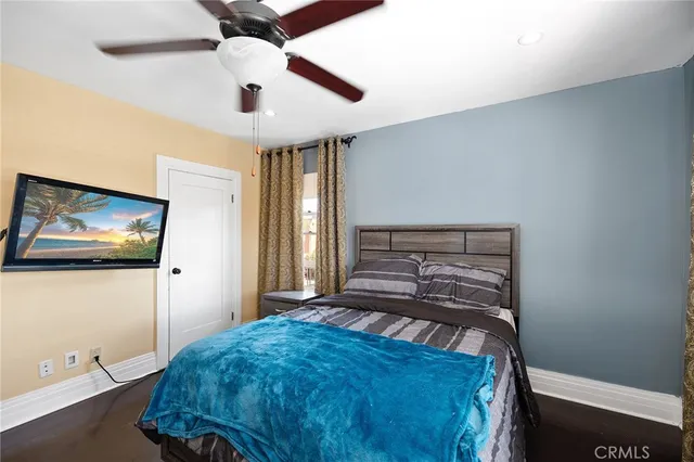 a view of a house with backyard water fountain and sitting area