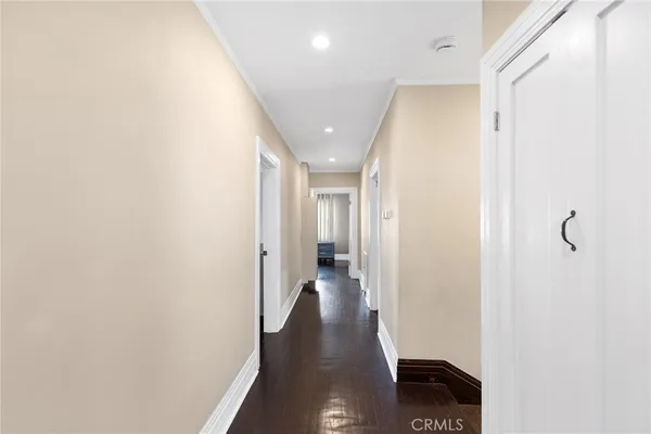 a aerial view of a house with a yard and potted plants