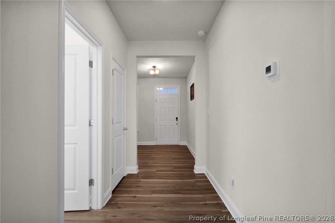 224 Timber Skip Drive Spring Lake, NC 28390 - Photo 5 of 30 a view of a hallway with wooden floor