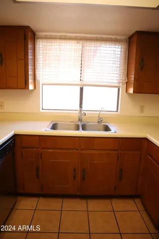 a kitchen with a sink and a window