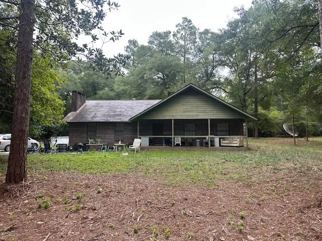 a house with trees in the background