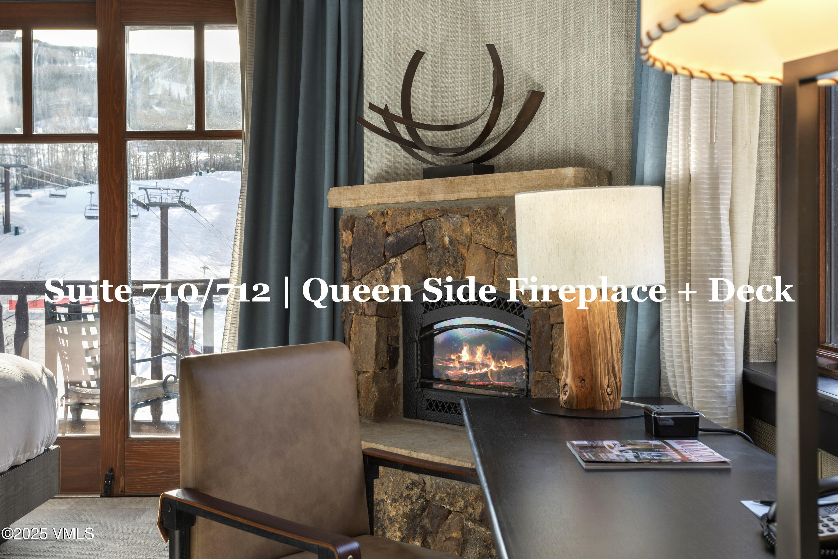 130 Daybreak Ridge Road, Unit HS710 Avon, CO 81620 - Photo 62 of 76 a living room with fireplace furniture and a large window