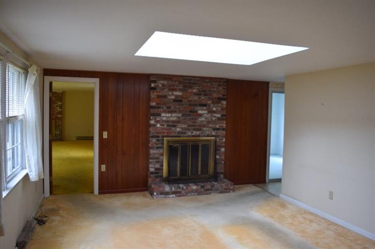 62 Cedar Land Road Orleans, MA 02653 - Photo 11 of 30 an empty room with windows and fireplace