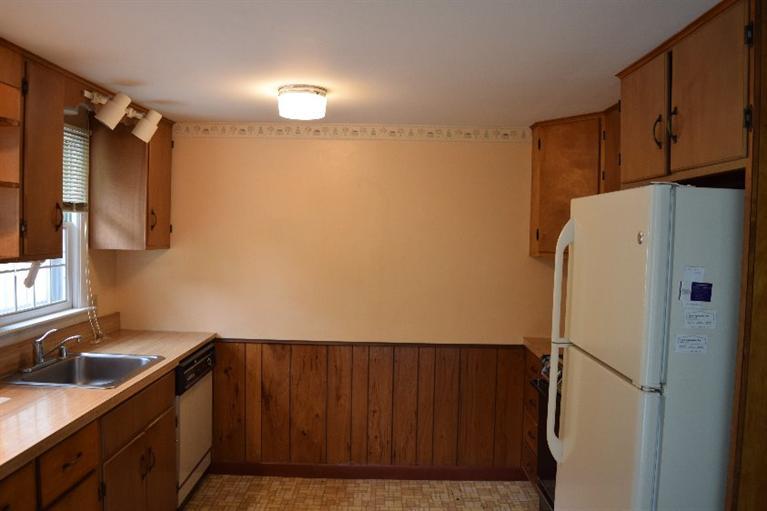 62 Cedar Land Road Orleans, MA 02653 - Photo 13 of 30 a kitchen with a refrigerator and a sink