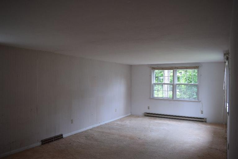 62 Cedar Land Road Orleans, MA 02653 - Photo 14 of 30 an empty room with a empty space and windows