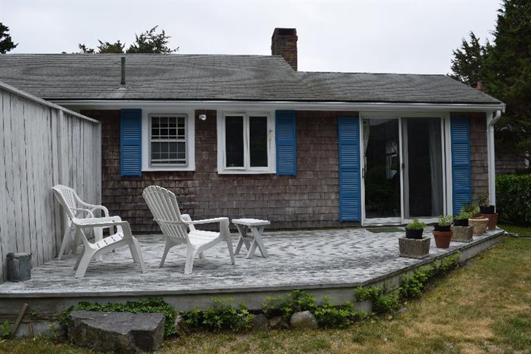 62 Cedar Land Road Orleans, MA 02653 - Photo 17 of 30 a front view of house with outdoor seating