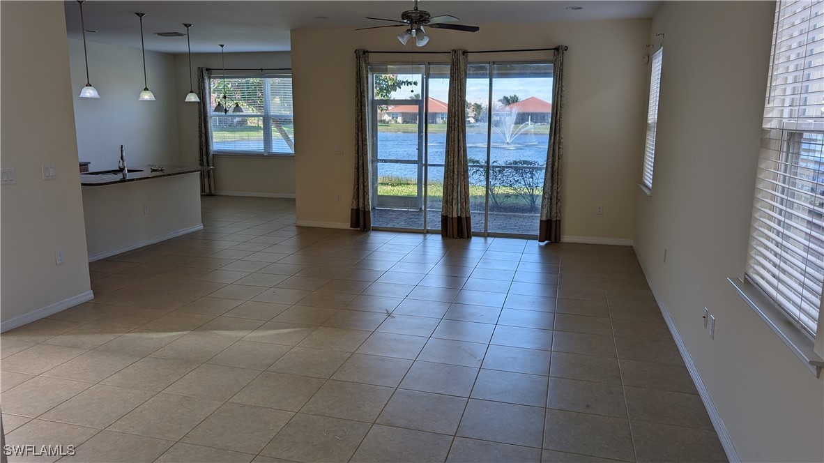 3552 Brittons Court Fort Myers, FL 33916 - Photo 11 of 27 wooden floor in an empty room with a window