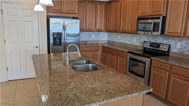 a kitchen with sink cabinets and window