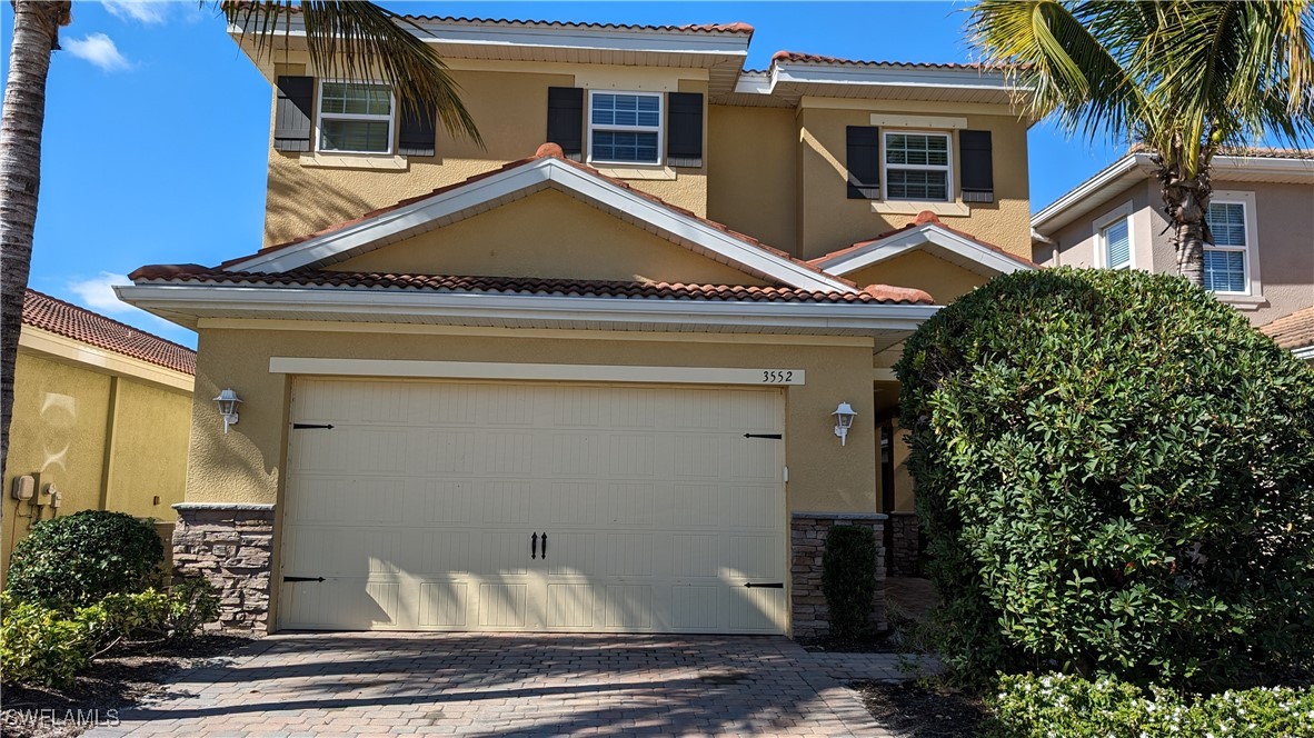3552 Brittons Court Fort Myers, FL 33916 - Photo 2 of 27 a view of a house with a potted plant and floor to ceiling window