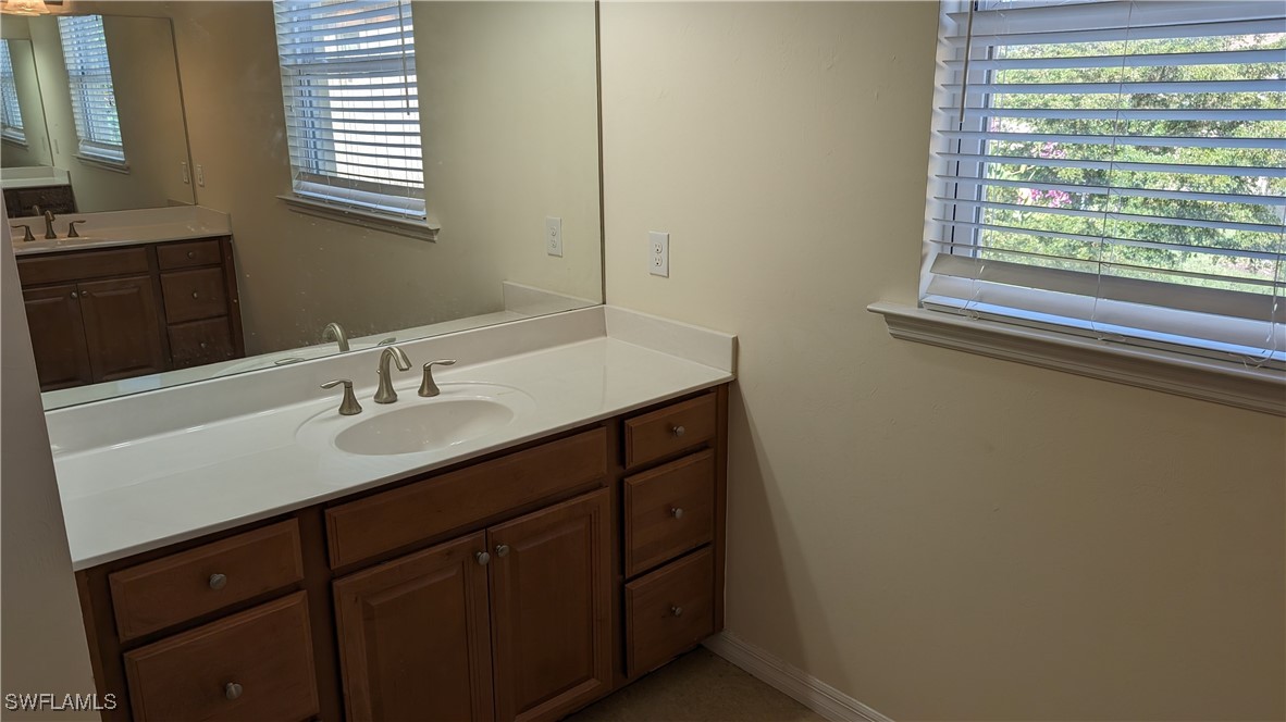3552 Brittons Court Fort Myers, FL 33916 - Photo 21 of 27 a bathroom with a sink and a window