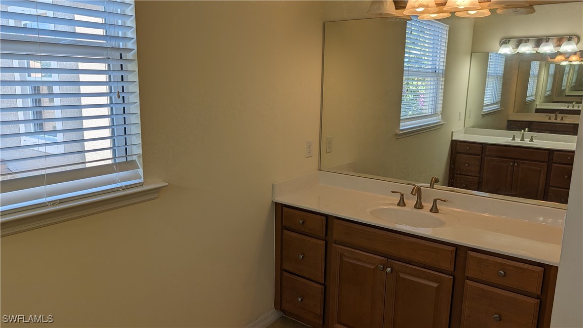 3552 Brittons Court Fort Myers, FL 33916 - Photo 22 of 27 a bathroom with a sink and a mirror