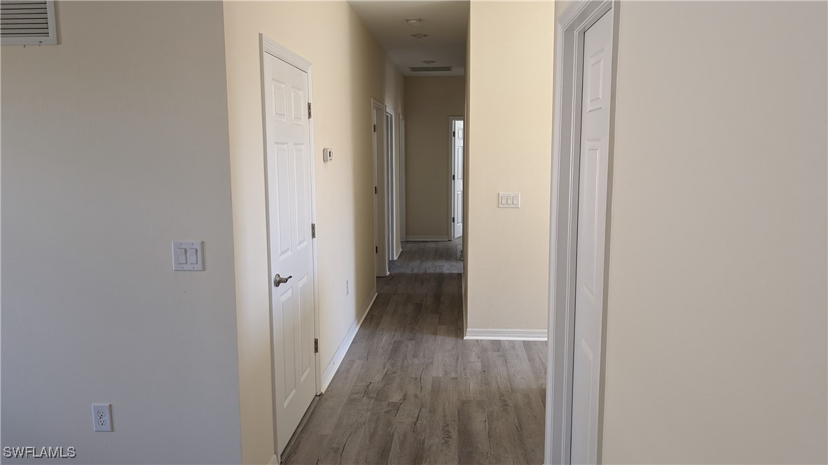 3552 Brittons Court Fort Myers, FL 33916 - Photo 25 of 27 a view of a hallway with wooden floor