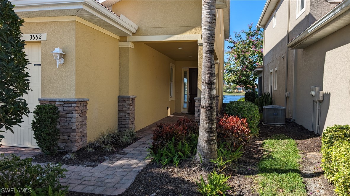 3552 Brittons Court Fort Myers, FL 33916 - Photo 4 of 27 a view of a house with a flower garden