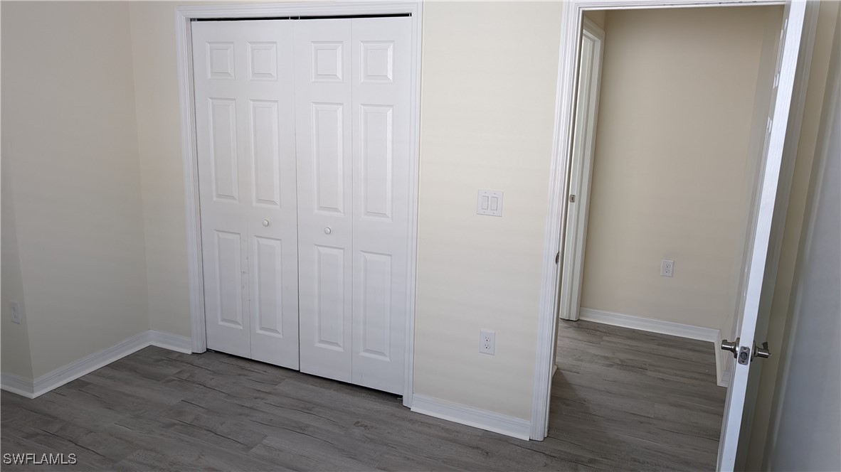 3552 Brittons Court Fort Myers, FL 33916 - Photo 10 of 27 an empty room with wooden floor