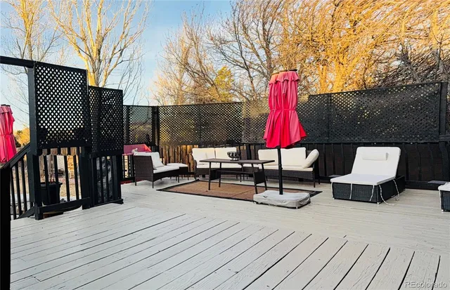 a view of sitting area with furniture and wooden floor