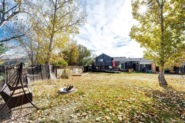 a swimming pool view with a seating space