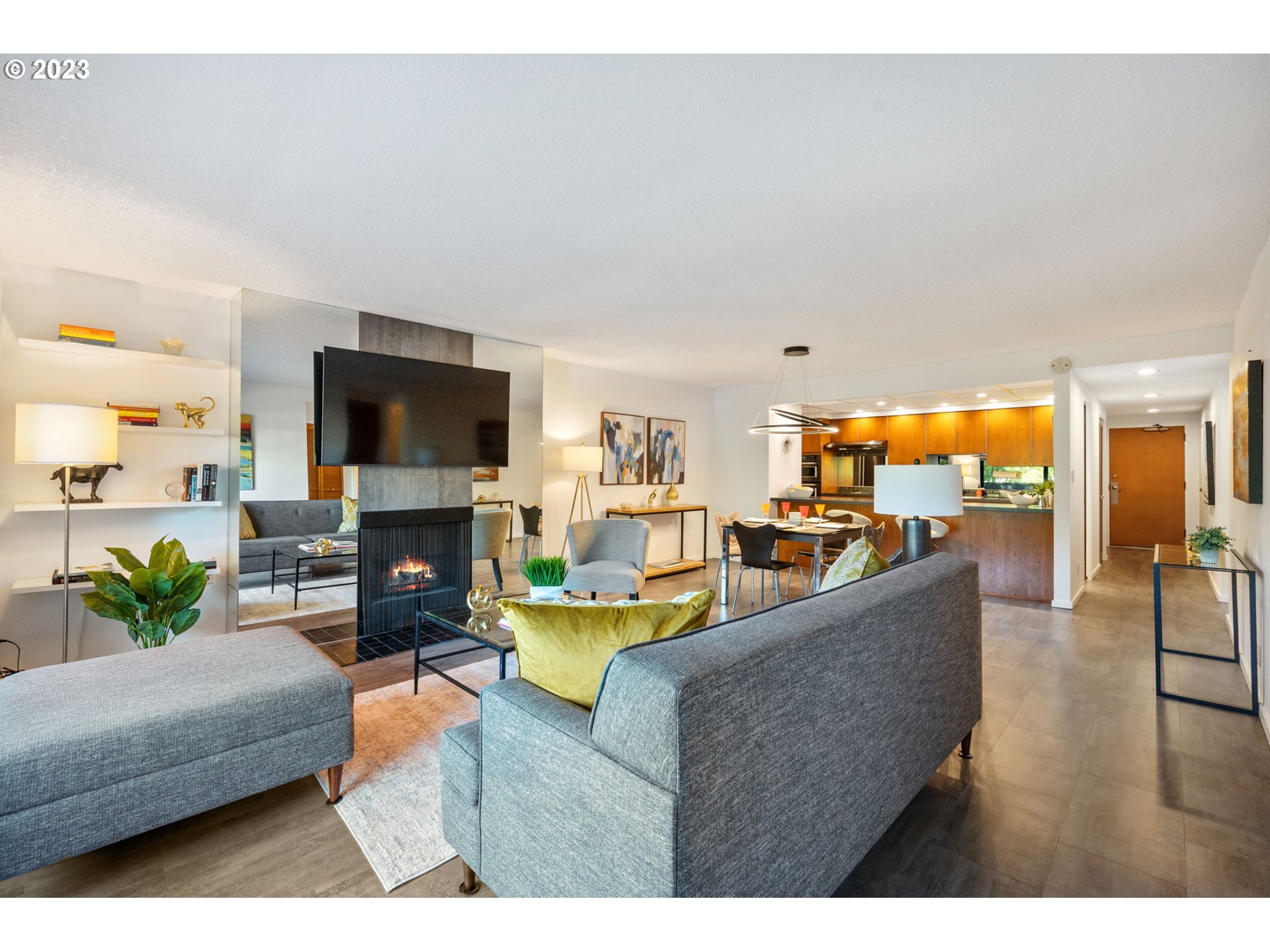 2309 Southwest 1st Avenue, Unit 441 Portland, OR 97201 - Photo 14 of 39 a living room with fireplace furniture and a flat screen tv