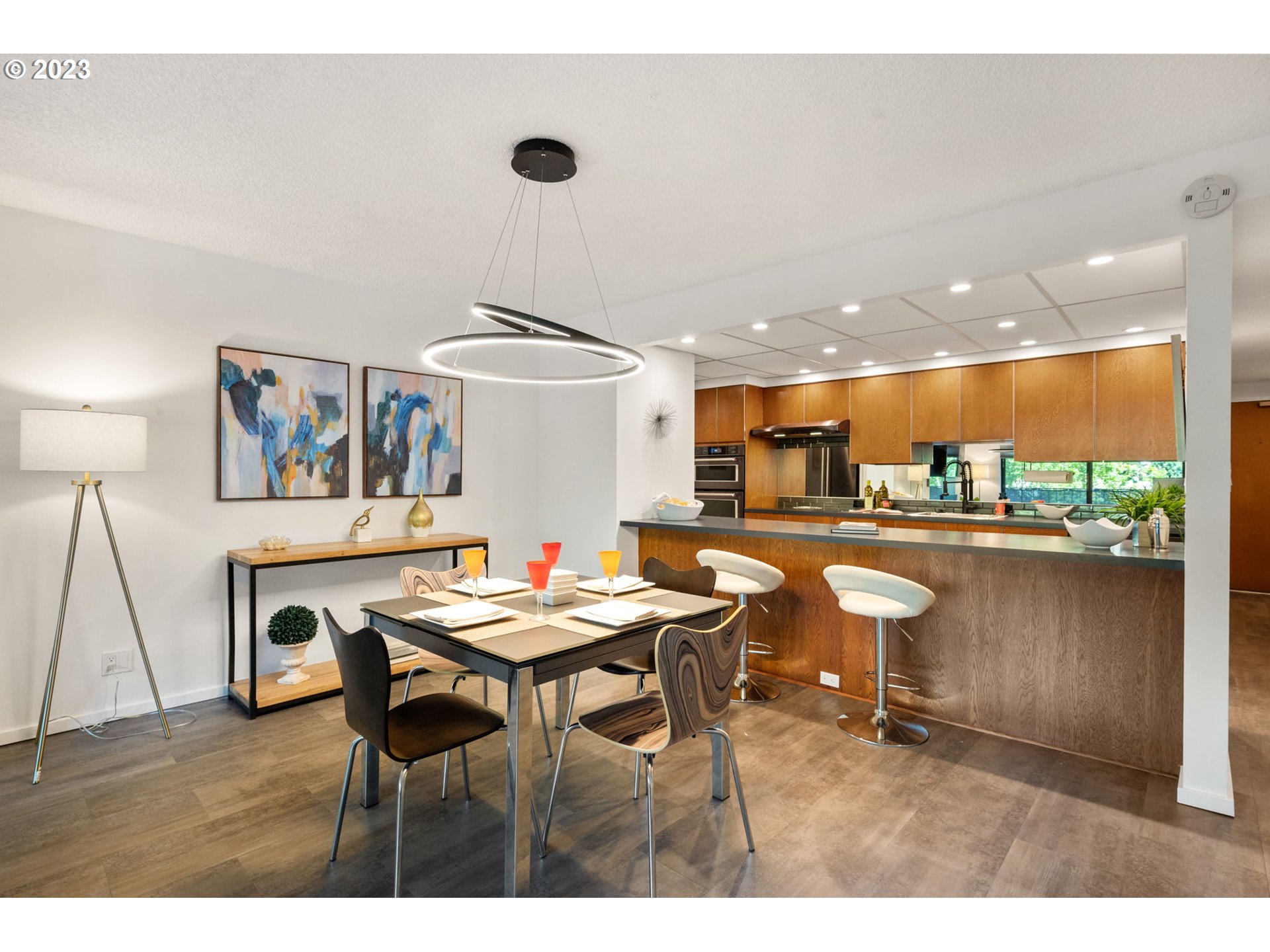2309 Southwest 1st Avenue, Unit 441 Portland, OR 97201 - Photo 16 of 39 a kitchen with a table and chairs in it