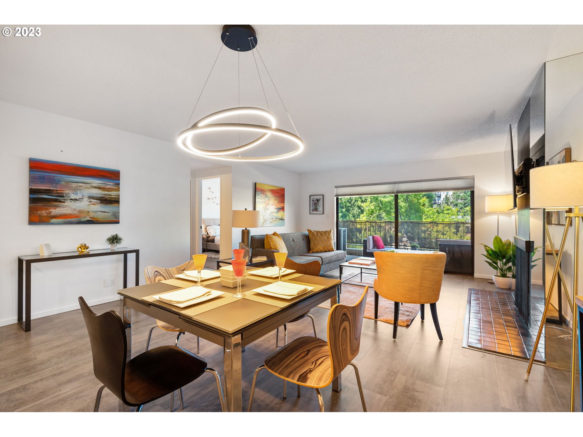 2309 Southwest 1st Avenue, Unit 441 Portland, OR 97201 - Photo 17 of 39 a view of a dining room with furniture window and wooden floor