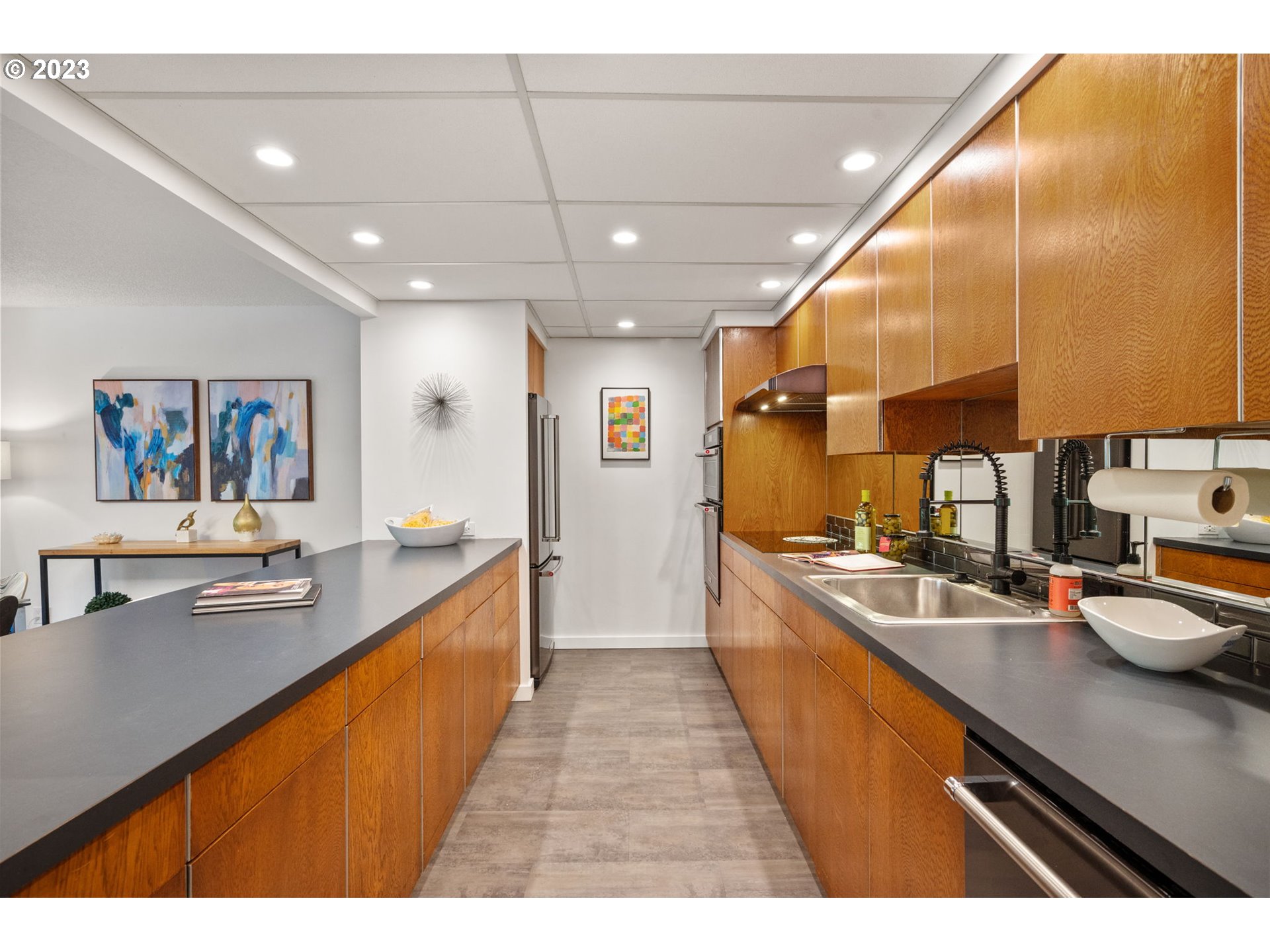 2309 Southwest 1st Avenue, Unit 441 Portland, OR 97201 - Photo 19 of 39 a large kitchen with stainless steel appliances lots of counter top space