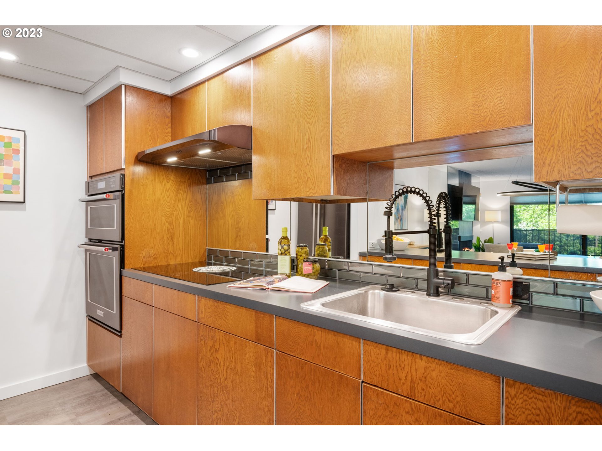 2309 Southwest 1st Avenue, Unit 441 Portland, OR 97201 - Photo 20 of 39 a kitchen with a sink and cabinets