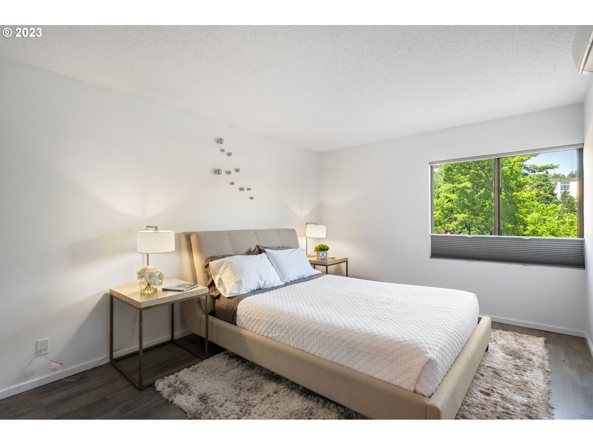 2309 Southwest 1st Avenue, Unit 441 Portland, OR 97201 - Photo 23 of 39 a bedroom with a bed and a window