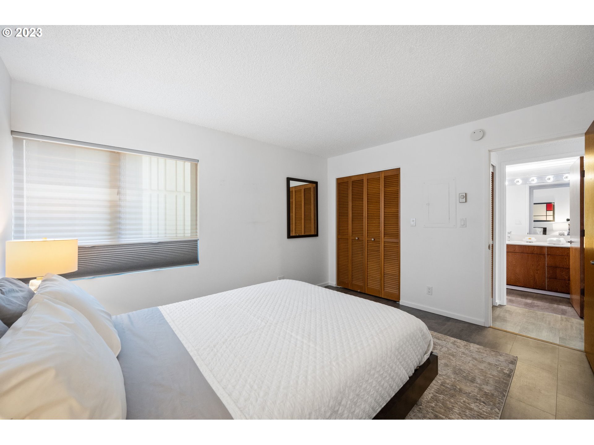 2309 Southwest 1st Avenue, Unit 441 Portland, OR 97201 - Photo 26 of 39 a bedroom with a bed and a couch