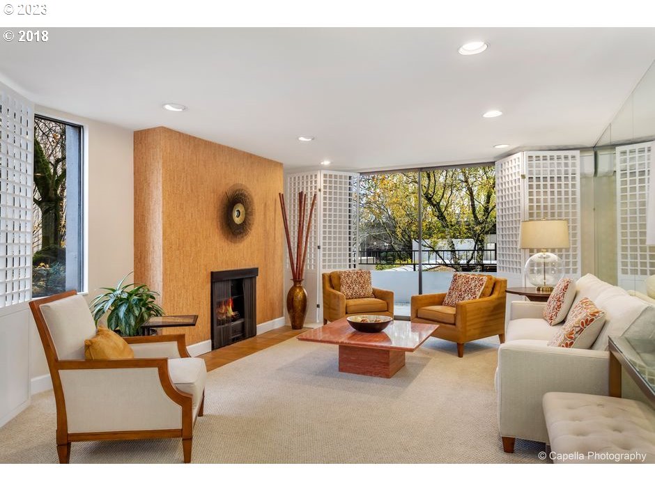 2309 Southwest 1st Avenue, Unit 441 Portland, OR 97201 - Photo 3 of 39 a living room with furniture large window and a fireplace