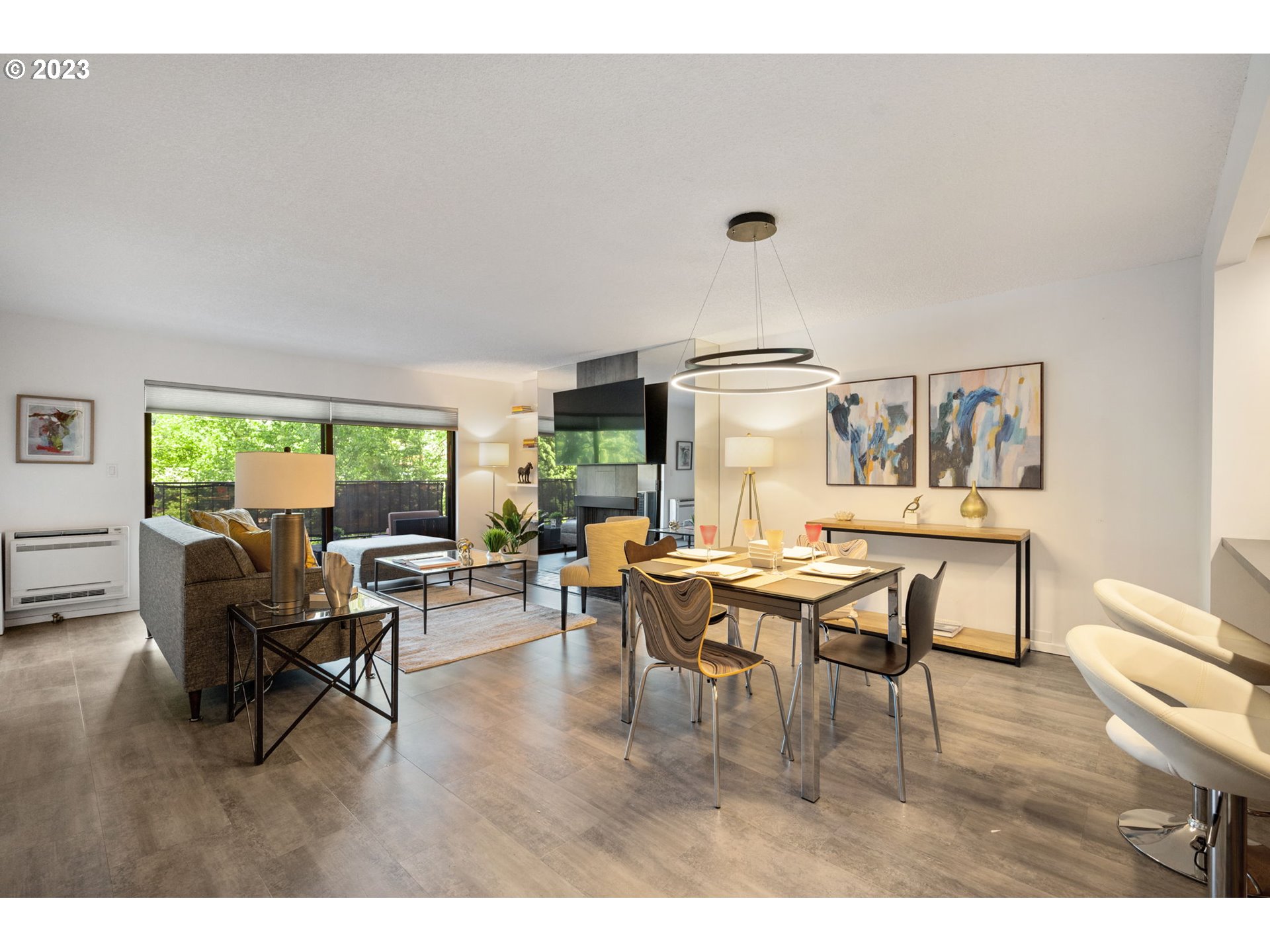 2309 Southwest 1st Avenue, Unit 441 Portland, OR 97201 - Photo 5 of 39 a view of a dining room with furniture and a large window