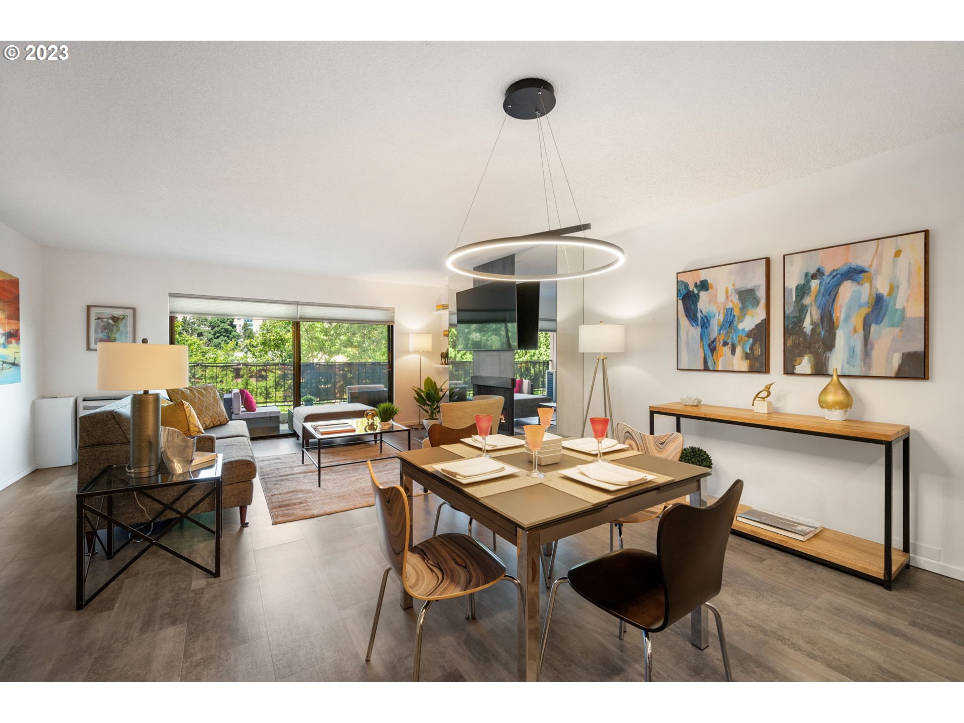 2309 Southwest 1st Avenue, Unit 441 Portland, OR 97201 - Photo 6 of 39 a living room with furniture a table and a large window