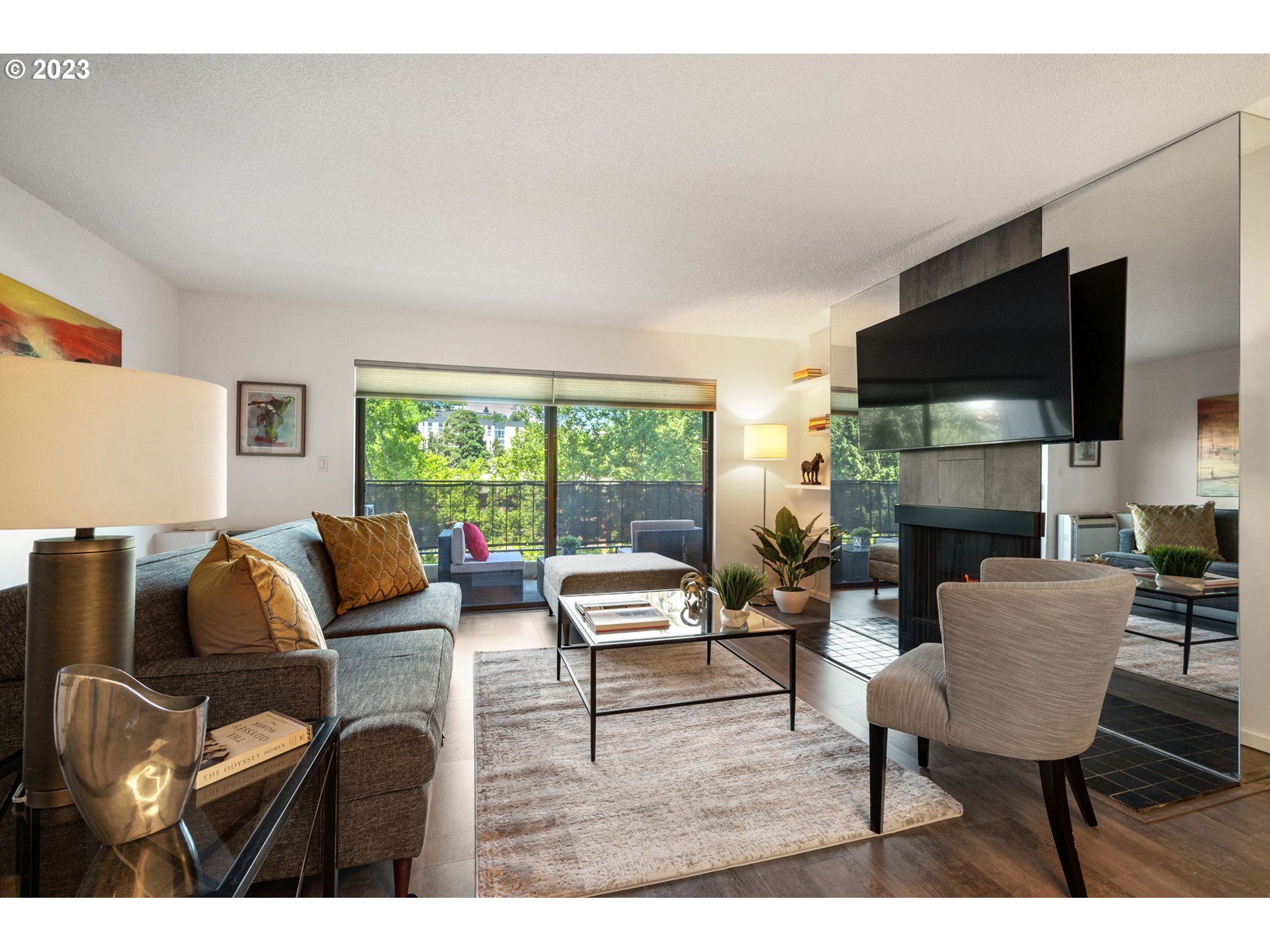 2309 Southwest 1st Avenue, Unit 441 Portland, OR 97201 - Photo 7 of 39 a living room with furniture a flat screen tv and a large window