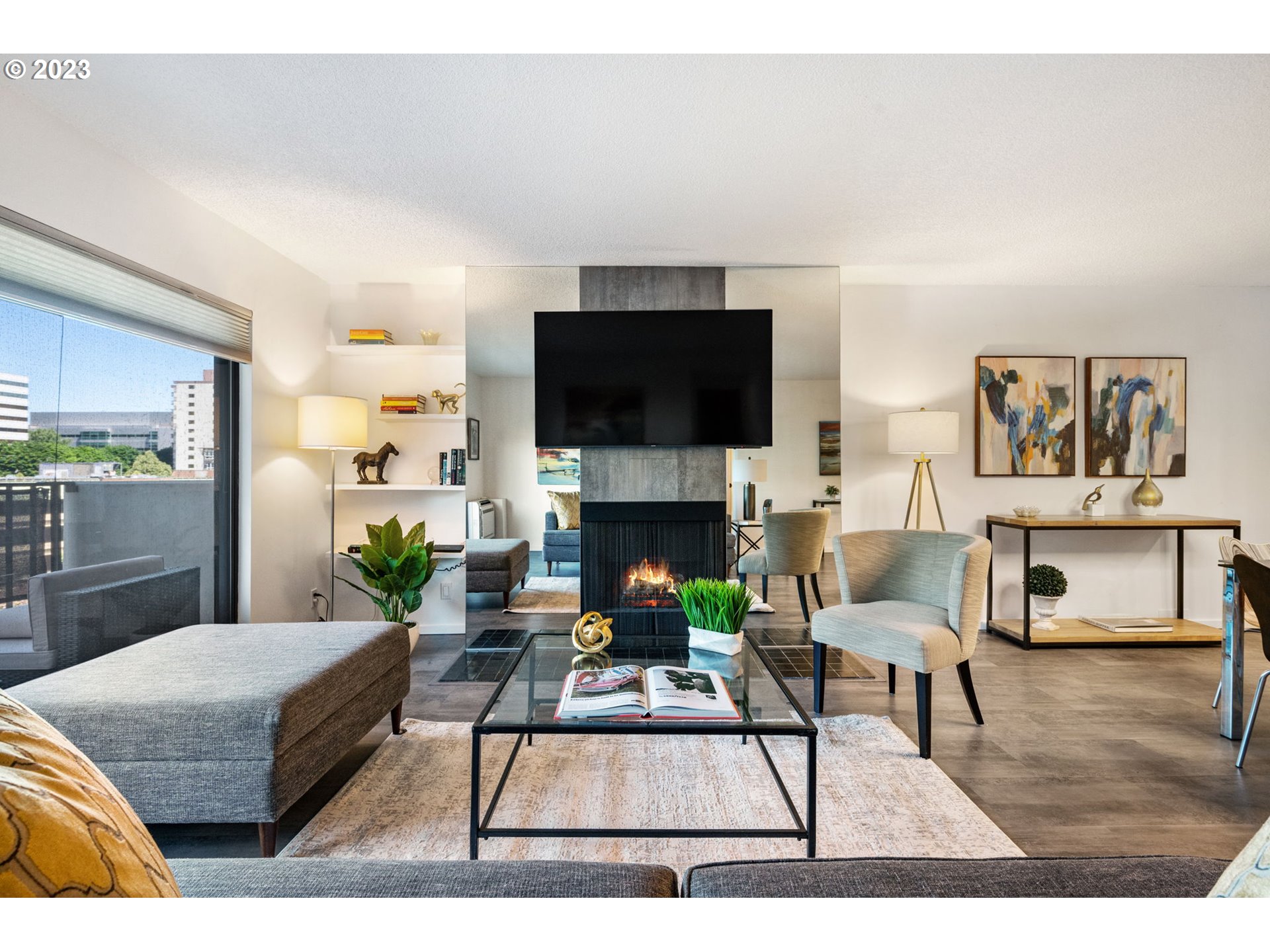 2309 Southwest 1st Avenue, Unit 441 Portland, OR 97201 - Photo 8 of 39 a living room with furniture and a flat screen tv