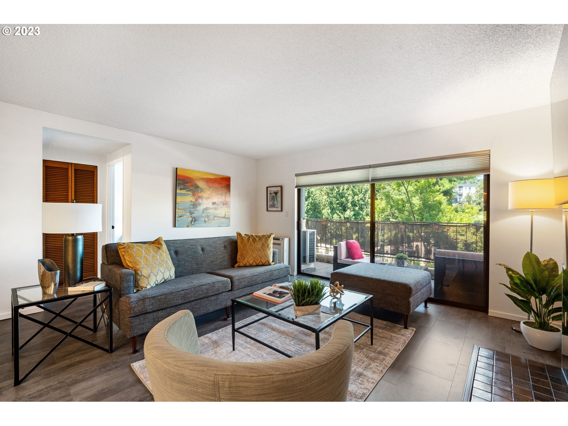 2309 Southwest 1st Avenue, Unit 441 Portland, OR 97201 - Photo 9 of 39 a living room with furniture and a large window